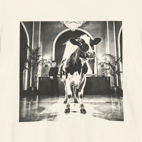Lobby Cow — close-up of the print on a natural tee